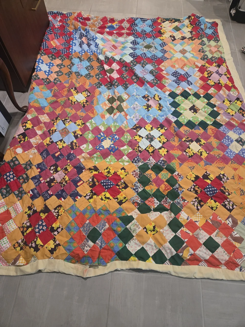 handmade patchwork quilt features a vibrant 